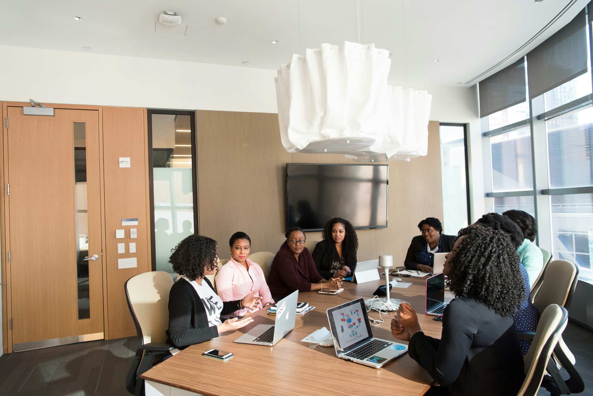 People sitting in meeting talking happily